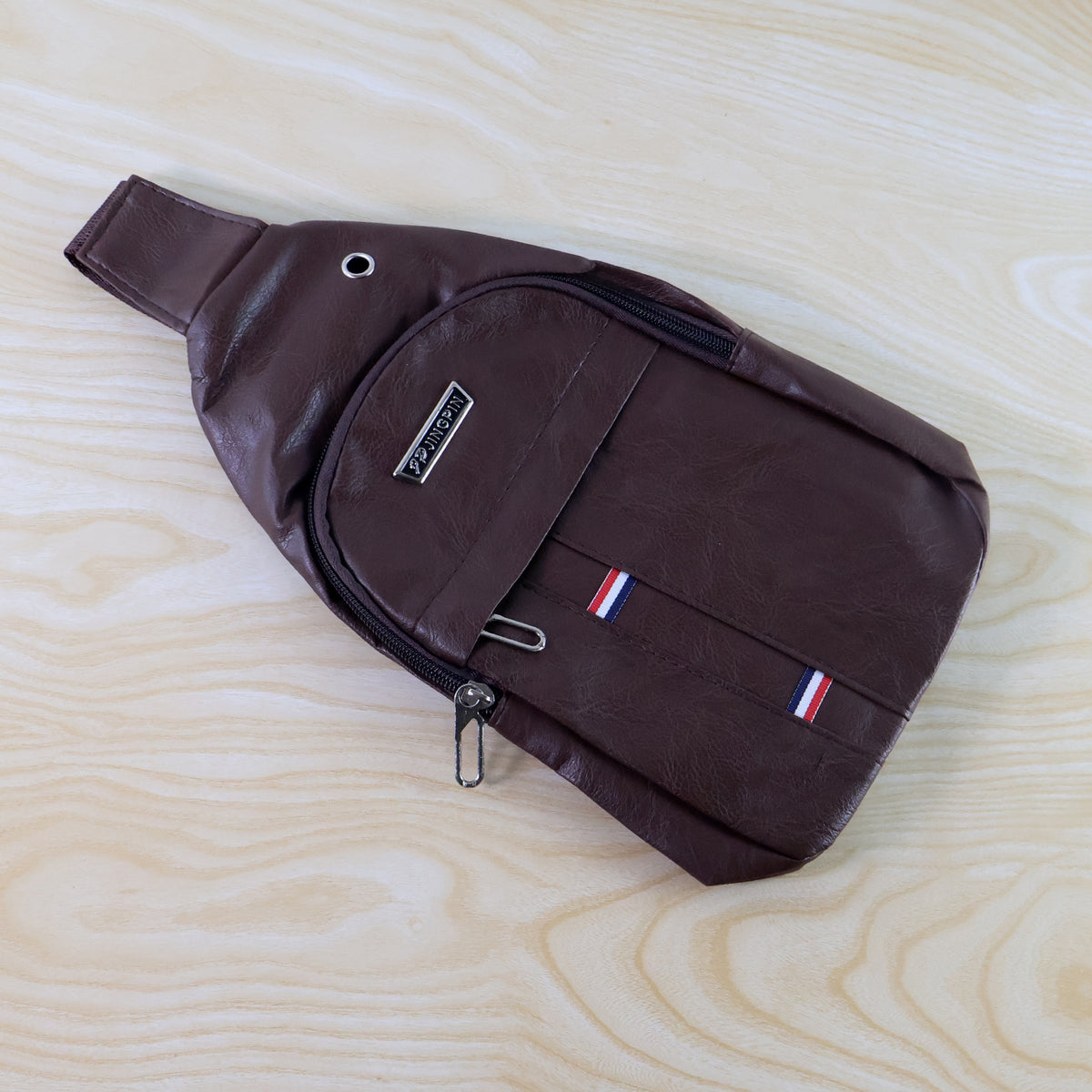 Wukusy waterproof anti-theft cross-body waist bag with USB charging and earphone hook, casual travel shoulder sling for men.