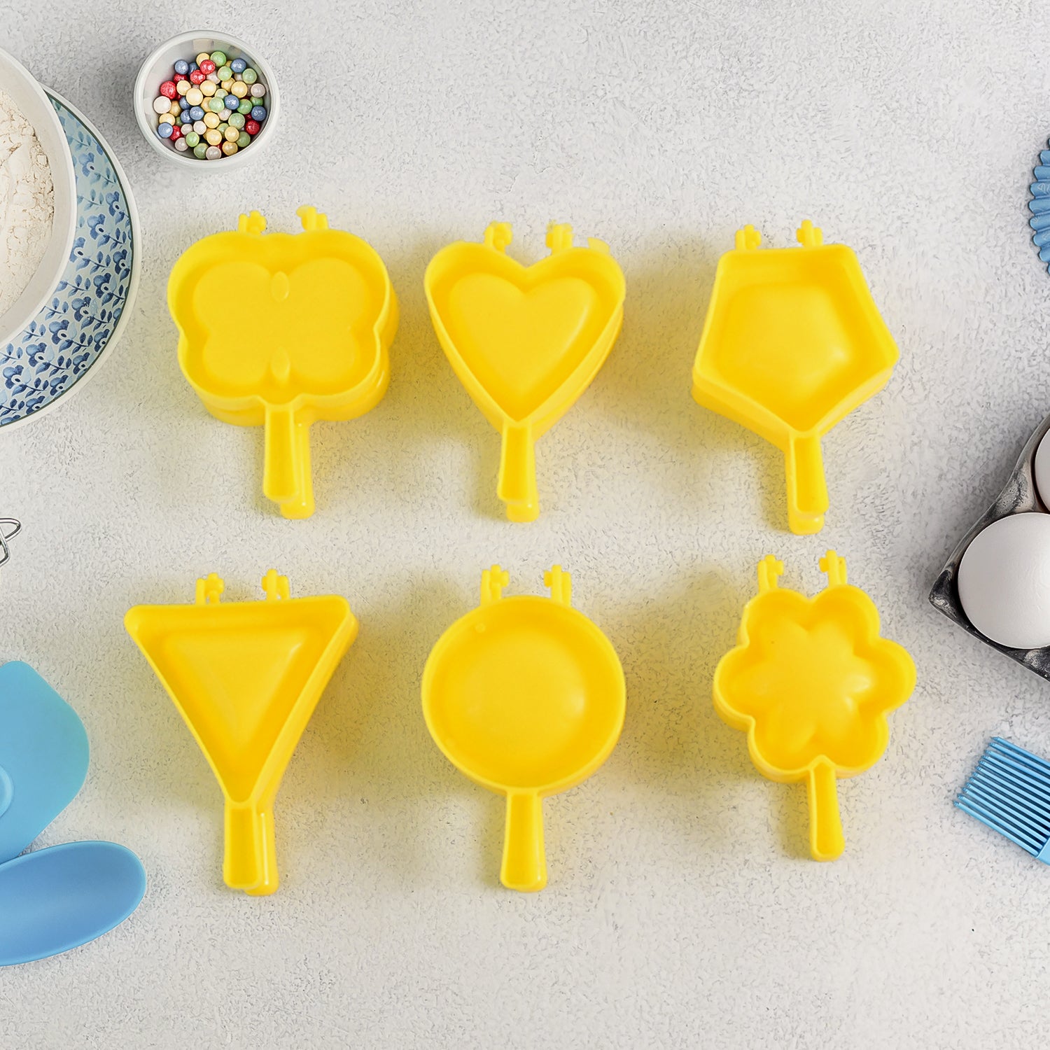 Six-piece Wukusy plastic cookie cutter set with various shapes, ideal for baking and decorating cookies in home and kitchen use.