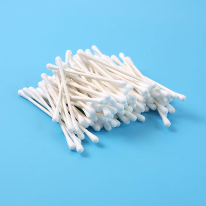 Box of 100 Wukusy paper-stick cotton swabs for health and beauty, with white cotton tips and biodegradable paper sticks.