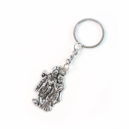 Set of two Wukusy Radha Krishna metal keychains with intricate design, featuring traditional Hindu deity motifs.