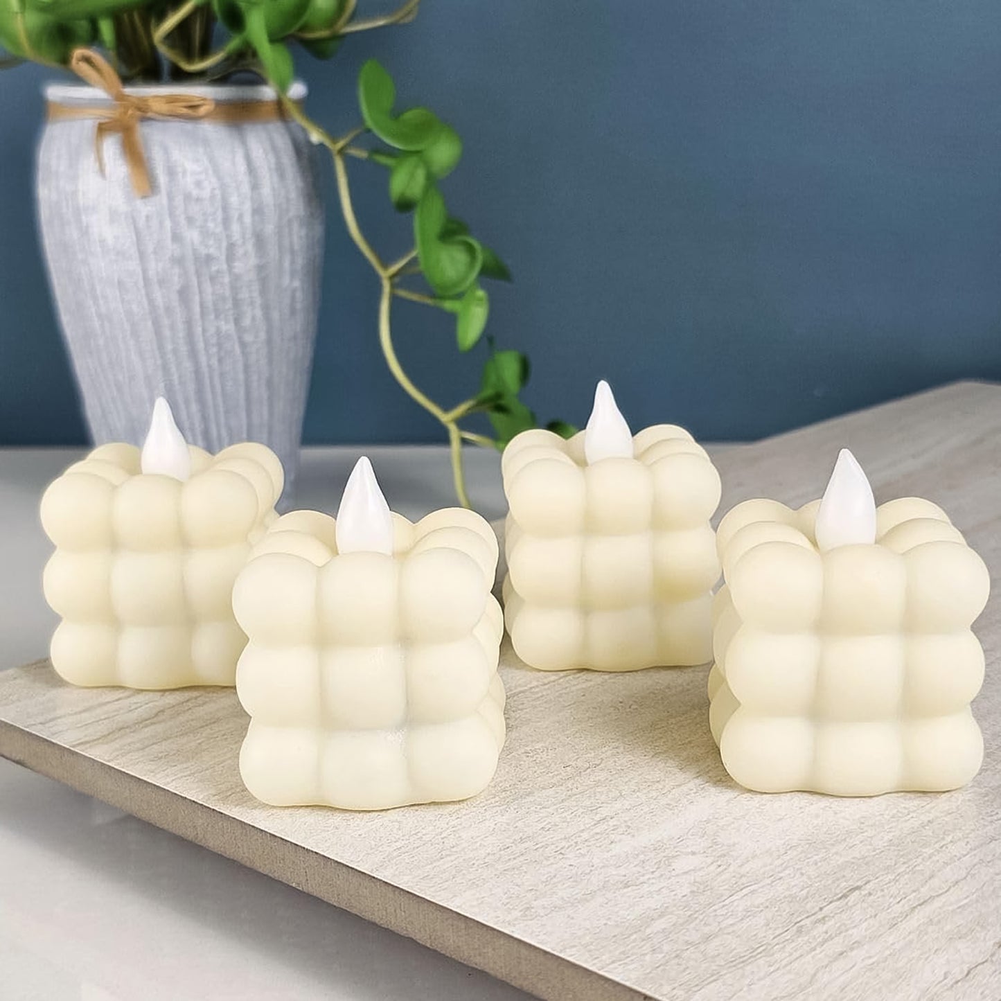 Set of 24 Wukusy LED flameless cube decorative candles, perfect for home decor and creating a warm, cozy ambiance.