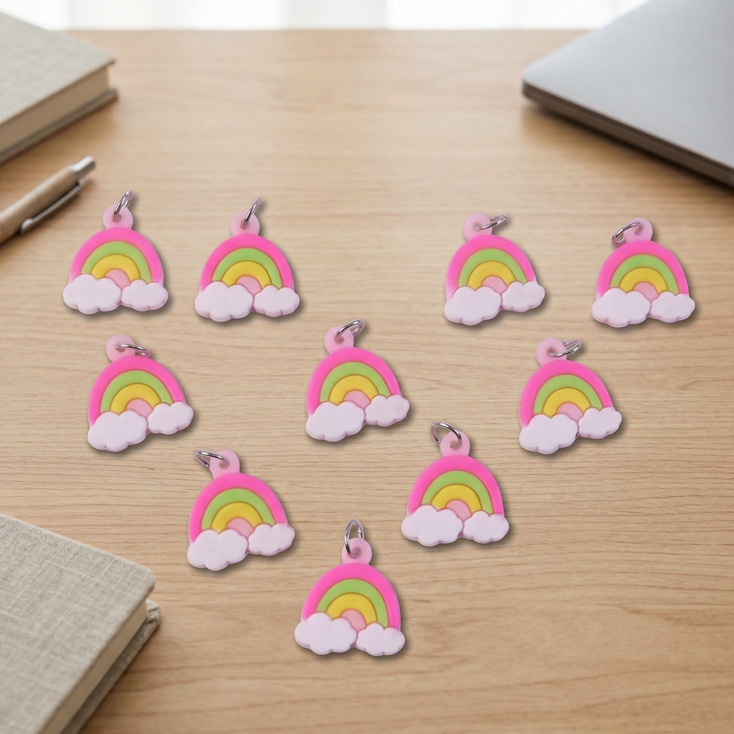 Set of 10 colorful rainbow cloud bag charm keychains from Wukusy, featuring adorable cloud and rainbow designs.