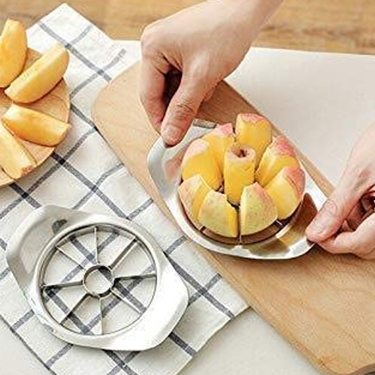 Heavy duty stainless steel apple cutter and slicer by Wukusy, showing sharp blades and sturdy handle for efficient apple slicing.