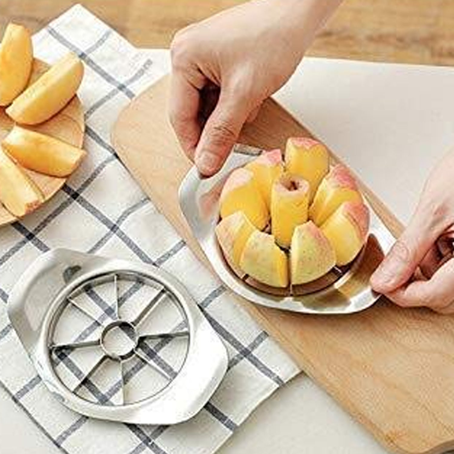 Heavy duty stainless steel apple cutter and slicer by Wukusy, showing sharp blades and sturdy handle for efficient apple slicing.