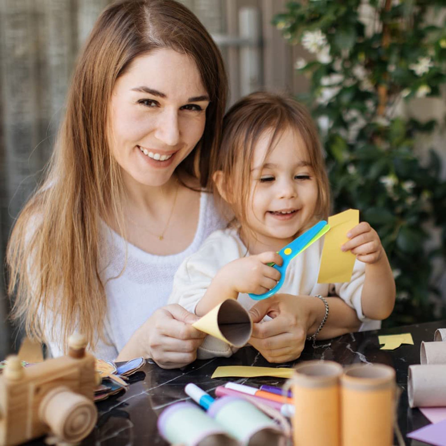 Child-safe plastic safety scissors by Wukusy, designed for kids, with rounded blades and colorful handles for safe cutting.
