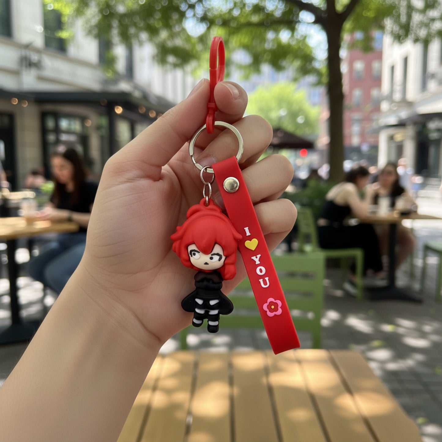 Cute red-haired cartoon girl silicone keychain by Wukusy, featuring a playful girl design on a colorful keychain.