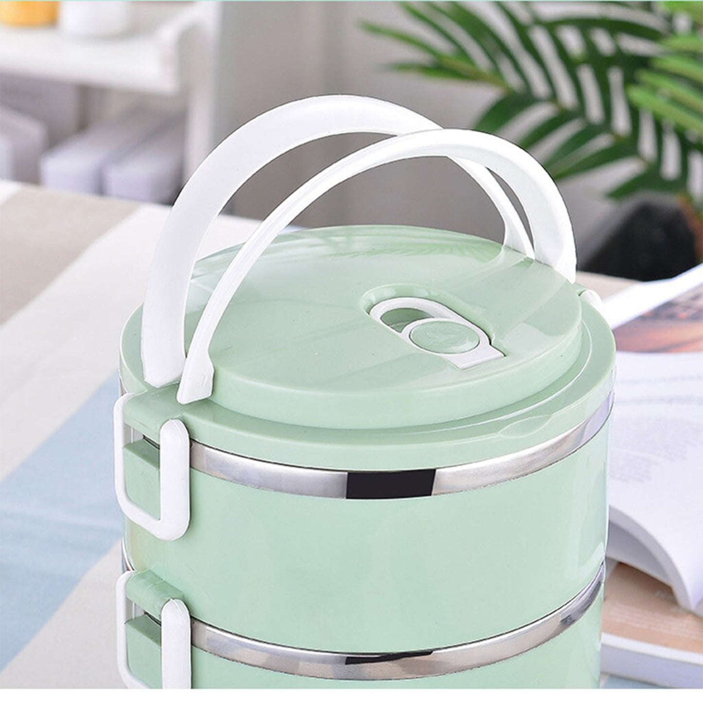 Multi-layer stainless steel hot lunch box with four compartments from Wukusy, ideal for keeping food warm and organized.