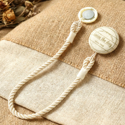 Elegant magnetic curtain tieback by Wukusy holding curtains open with sleek design and strong magnetic clasp.