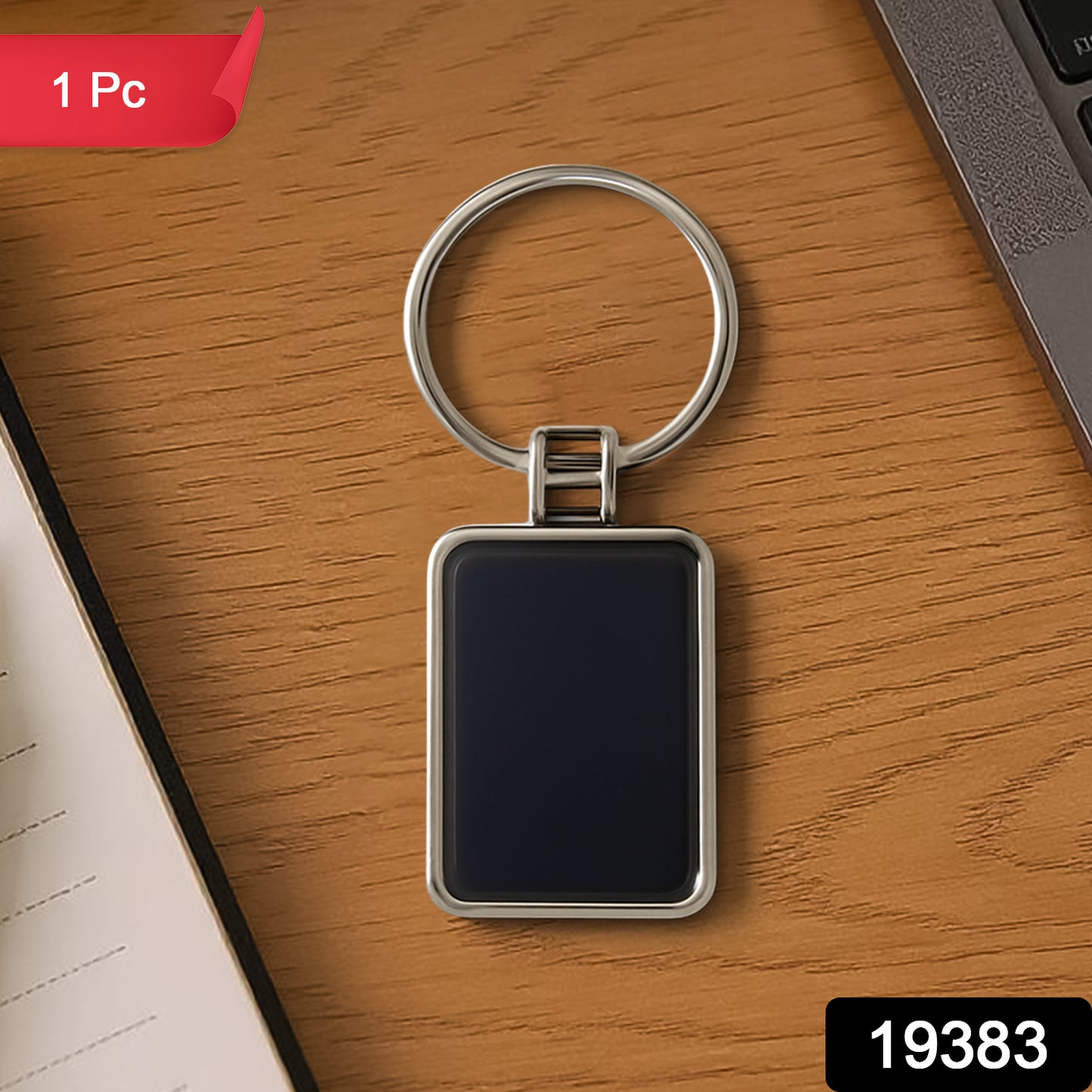 Black and silver rectangular metal keychain by Wukusy featuring a sleek, minimalist design with a sturdy keyring attachment.