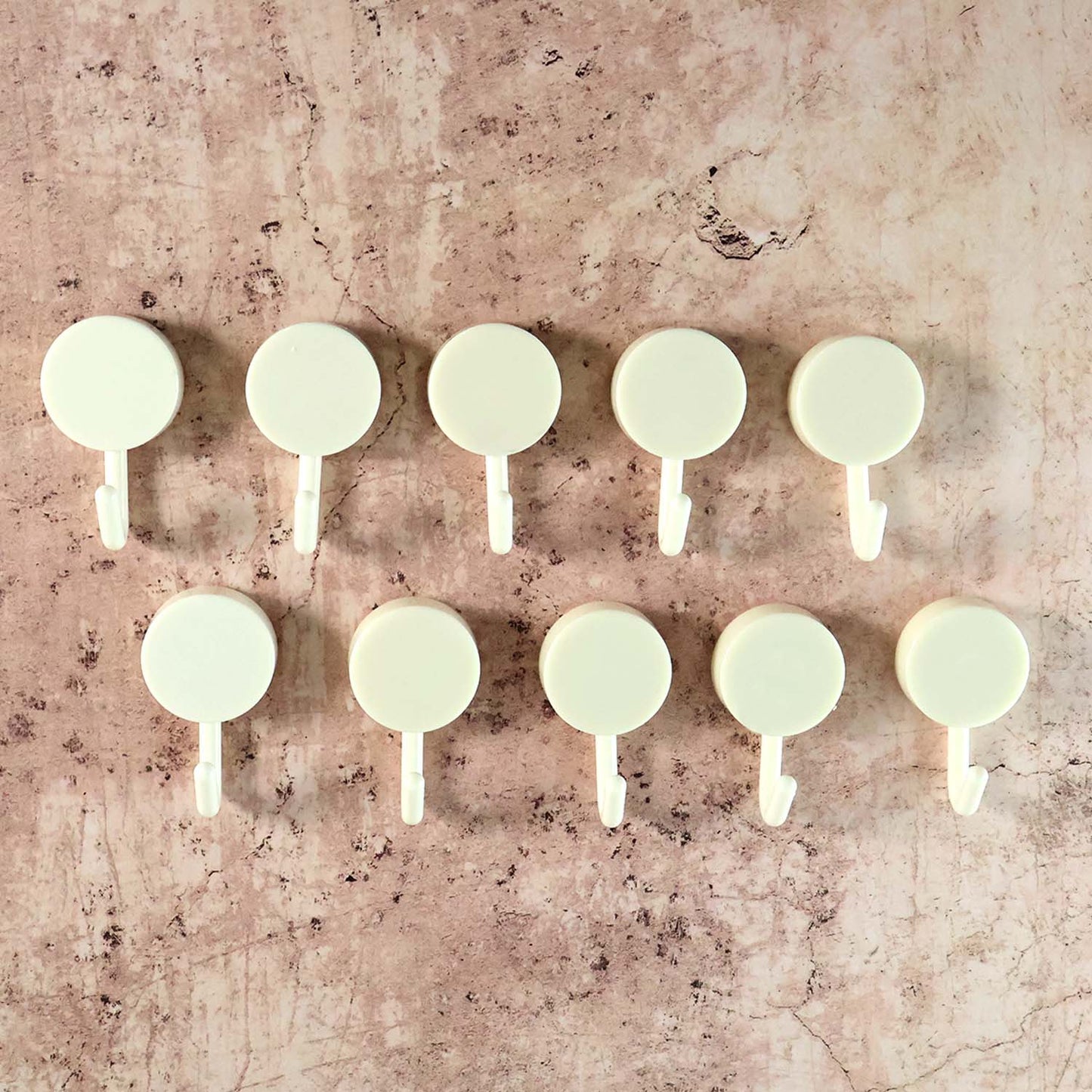 Set of 10 Wukusy self-adhesive round wall hooks for home improvement, shown attached to a wall for versatile hanging solutions.