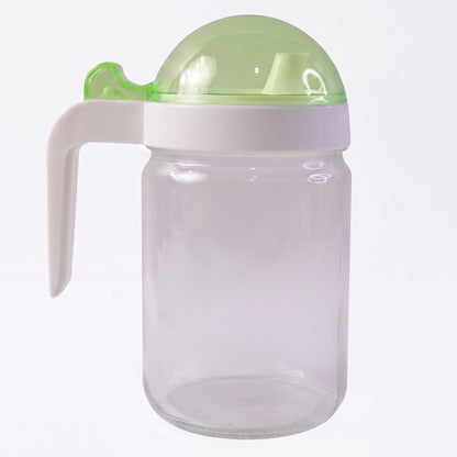 Wukusy glass oil bottle with lid, 580ml capacity, ideal for storing and pouring cooking oils, featuring a clear, sleek design.