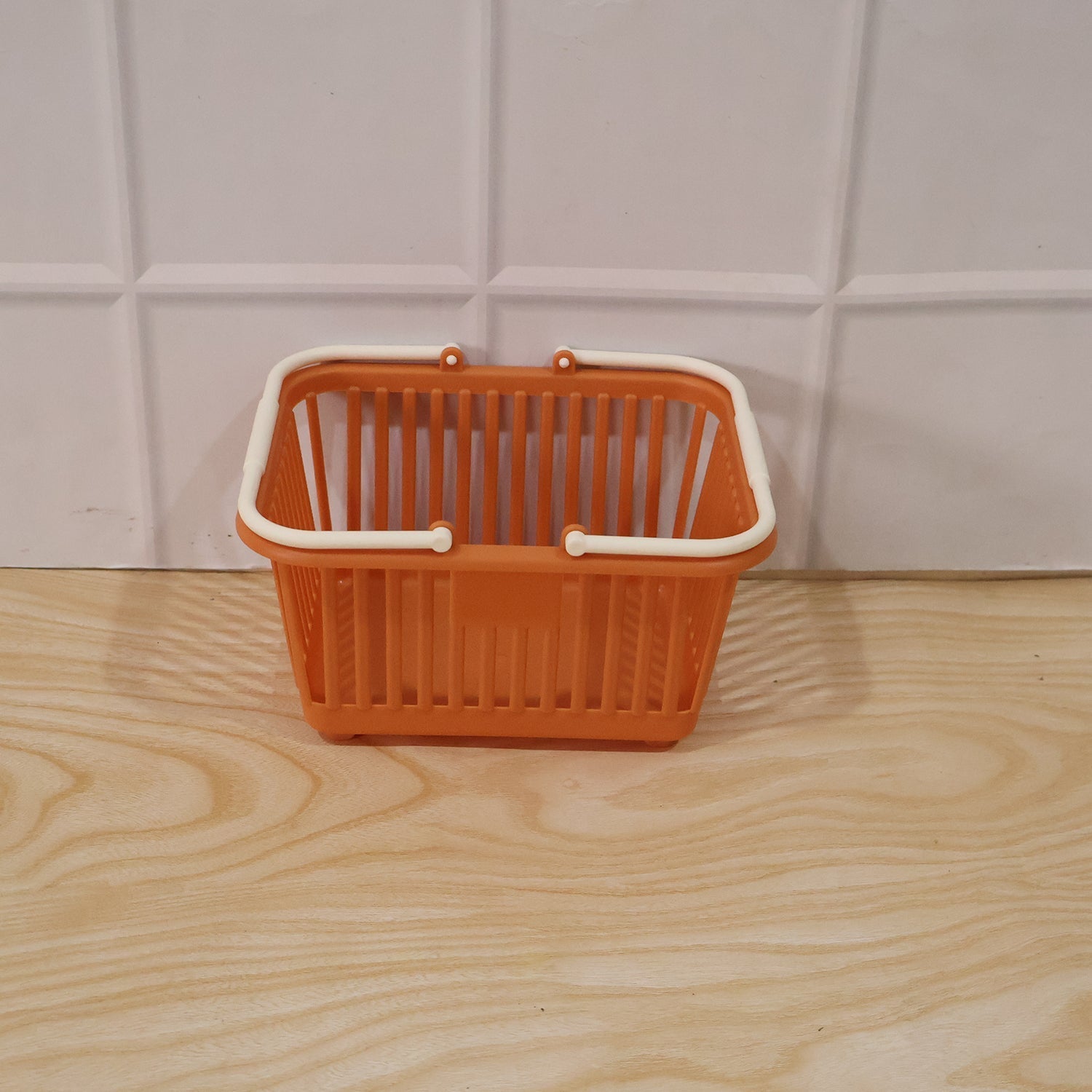 Wukusy plastic storage basket with foldable handles for fruits, vegetables, and groceries, showing the basket filled with produce.
