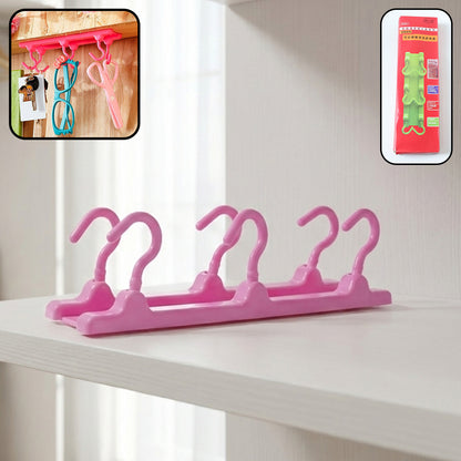 Wukusy multipurpose folding hanger hook organizer hanging on a wall, used for clothes, accessories, or storage.