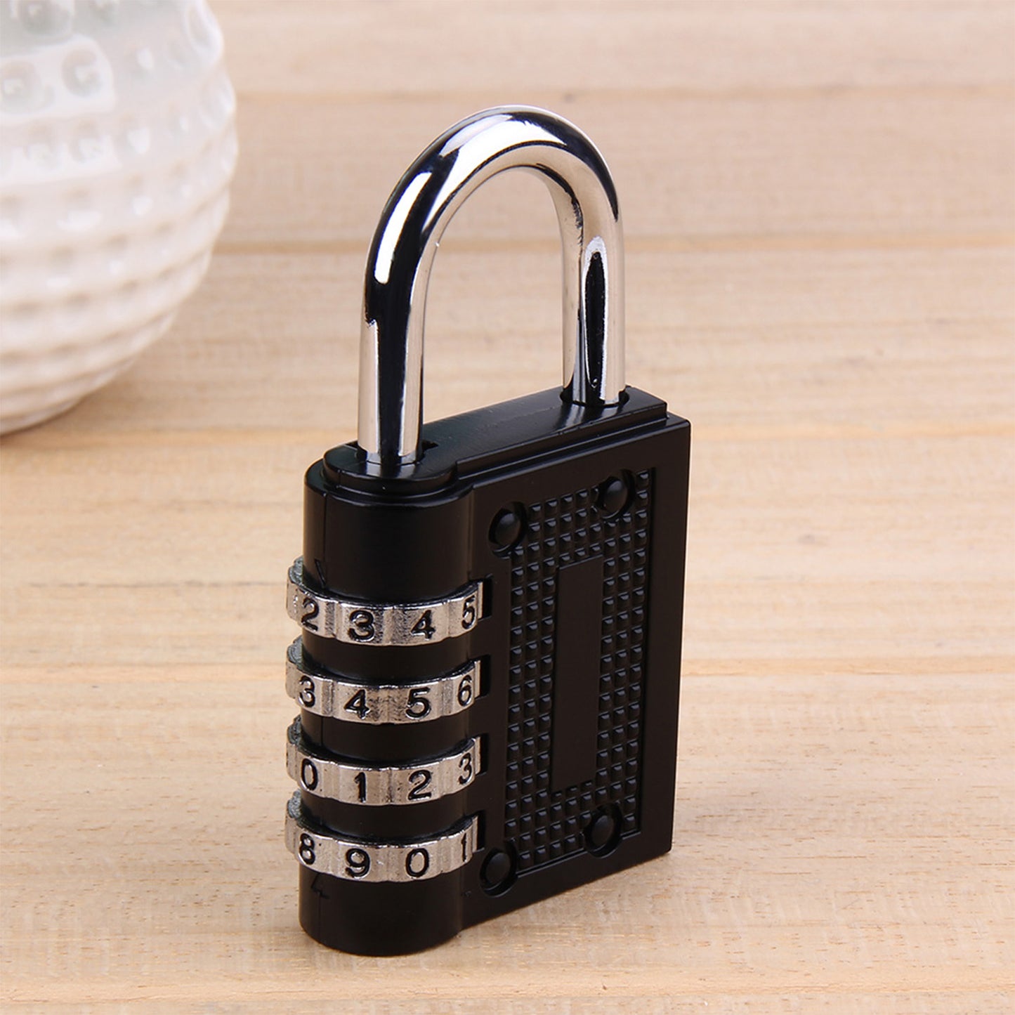 Wukusy 0218a security pad lock with a 4-digit combination, featuring a sturdy metal body and rotating dials for secure locking.