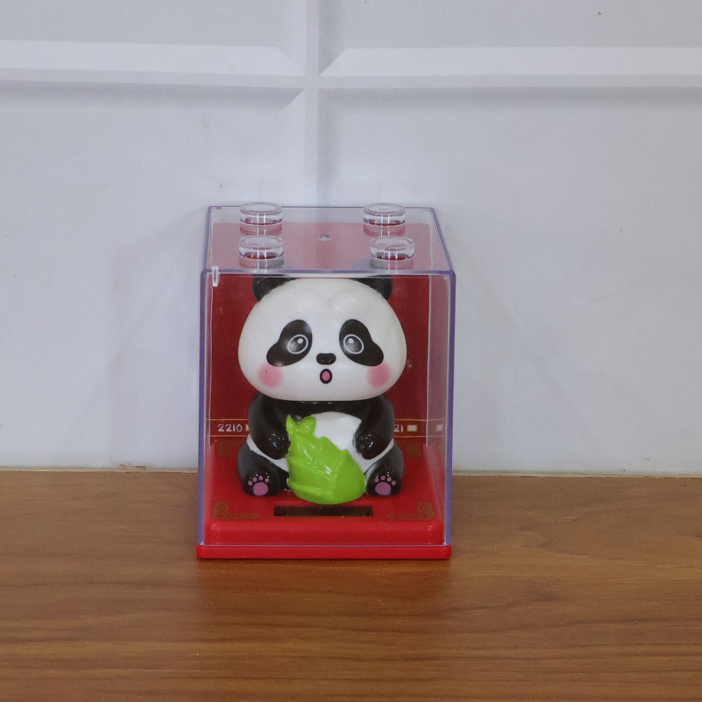 Wukusy solar powered moving head panda showpiece with animated LED lights and playful design, ideal for decorative display