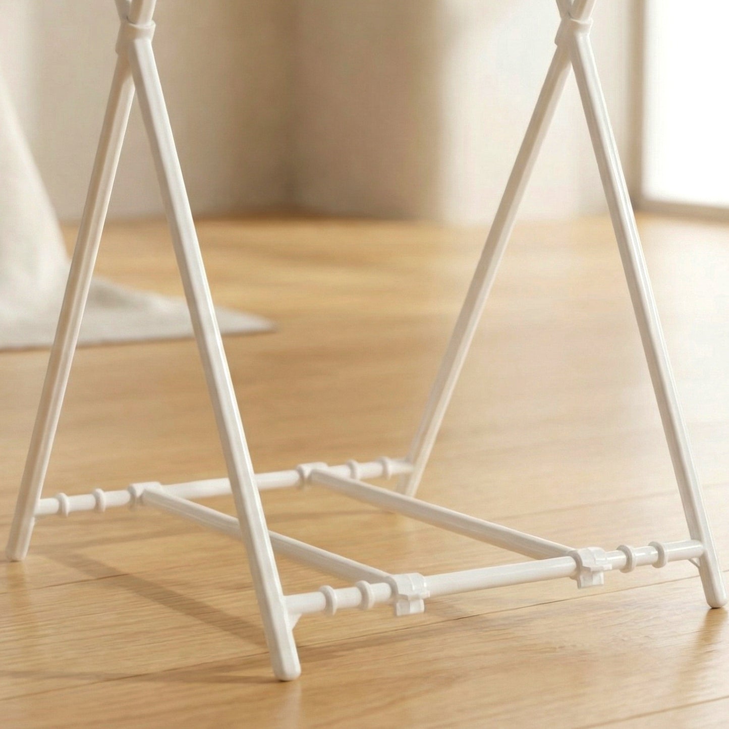 Wukusy foldable garbage bag holder stand with a black frame and foldable design, suitable for holding trash bags securely.