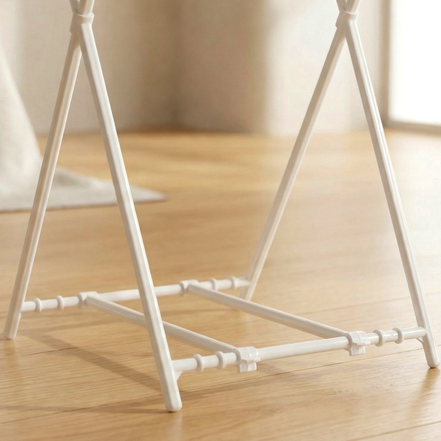 Wukusy foldable garbage bag holder stand with a black frame and foldable design, suitable for holding trash bags securely.