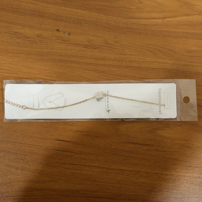 Elegant adjustable chain bracelet by Wukusy featuring mixed designs and a polished finish, displayed on a neutral background.