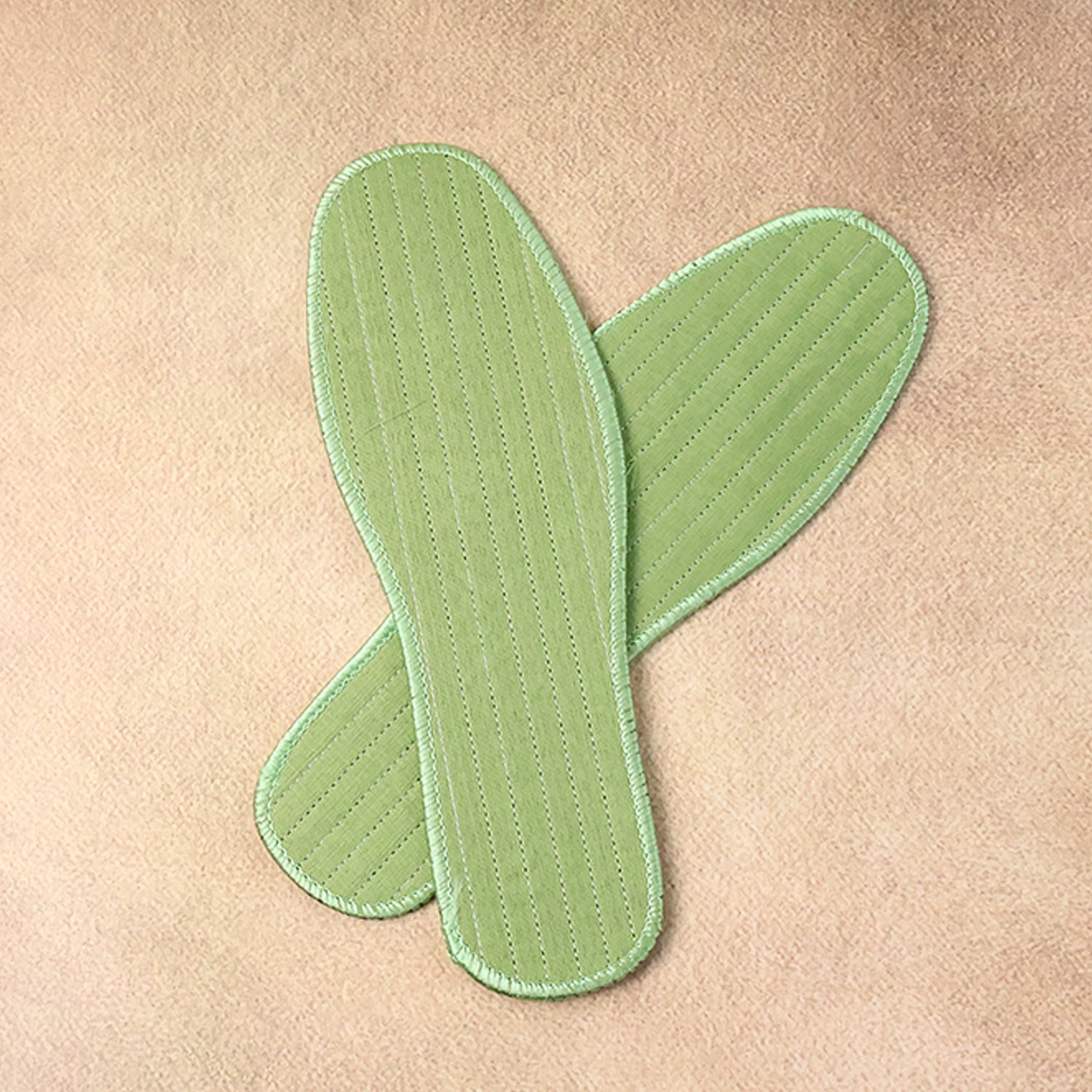 Pair of Wukusy premium comfort shoe insoles for size 42, designed for daily foot support, shown in a mix design pattern.