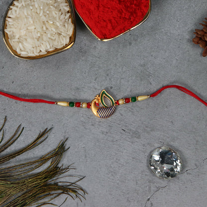 Colorful peacock feather rakhi from Wukusy, featuring intricate design with vibrant feathers for festive occasions.