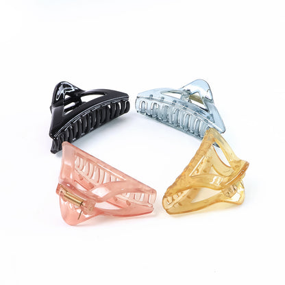 Colorful triangle shape plastic hair claw clip by Wukusy, durable grip for women and girls, perfect for fashionable hair styling.