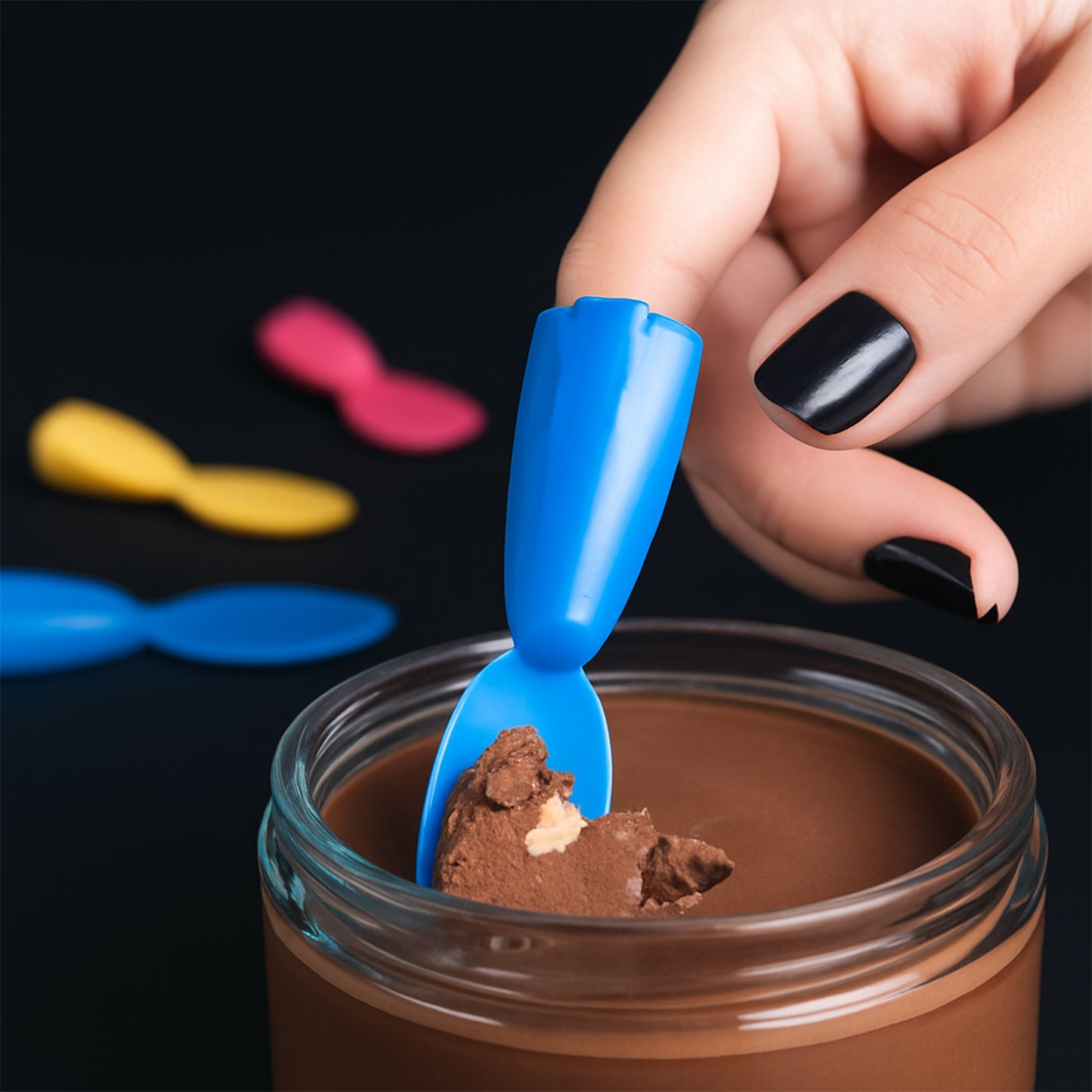 Mini Wukusy Finger Spoon Toy, small colorful silicone spoon for children’s play and sensory activities.