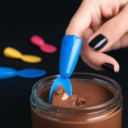 Mini Wukusy Finger Spoon Toy, small colorful silicone spoon for children’s play and sensory activities.