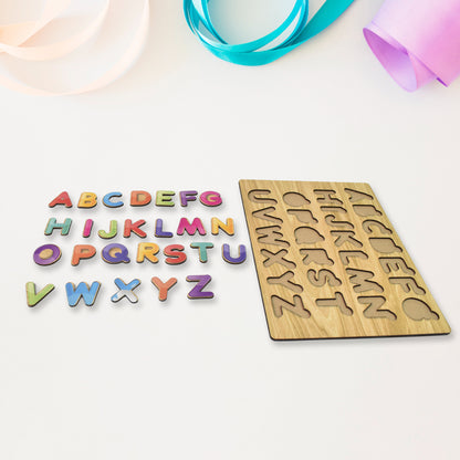 Wooden puzzle board with ABC letter shapes from Wukusy, educational learning toy for children, featuring colorful wooden letters and shapes.