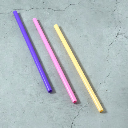 Colorful reusable Wukusy drinking straw for cold beverages, made of durable material, shown in multiple mixed colors.