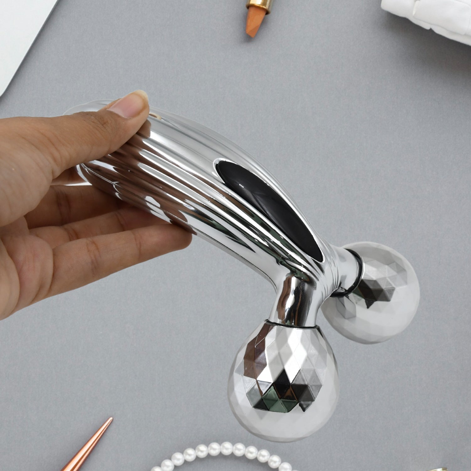 Wukusy 3D manual face roller massager showing textured surface for facial massage and skin tightening.