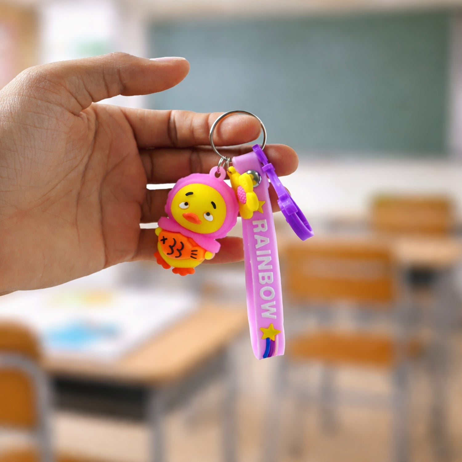 Cute rainbow strap cartoon duck keychain by Wukusy, featuring a colorful duck design with a strap for keys or bags.