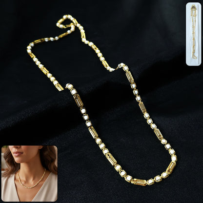Gold-tone designer chain necklace from Wukusy, featuring a sleek and stylish design with interconnected links.