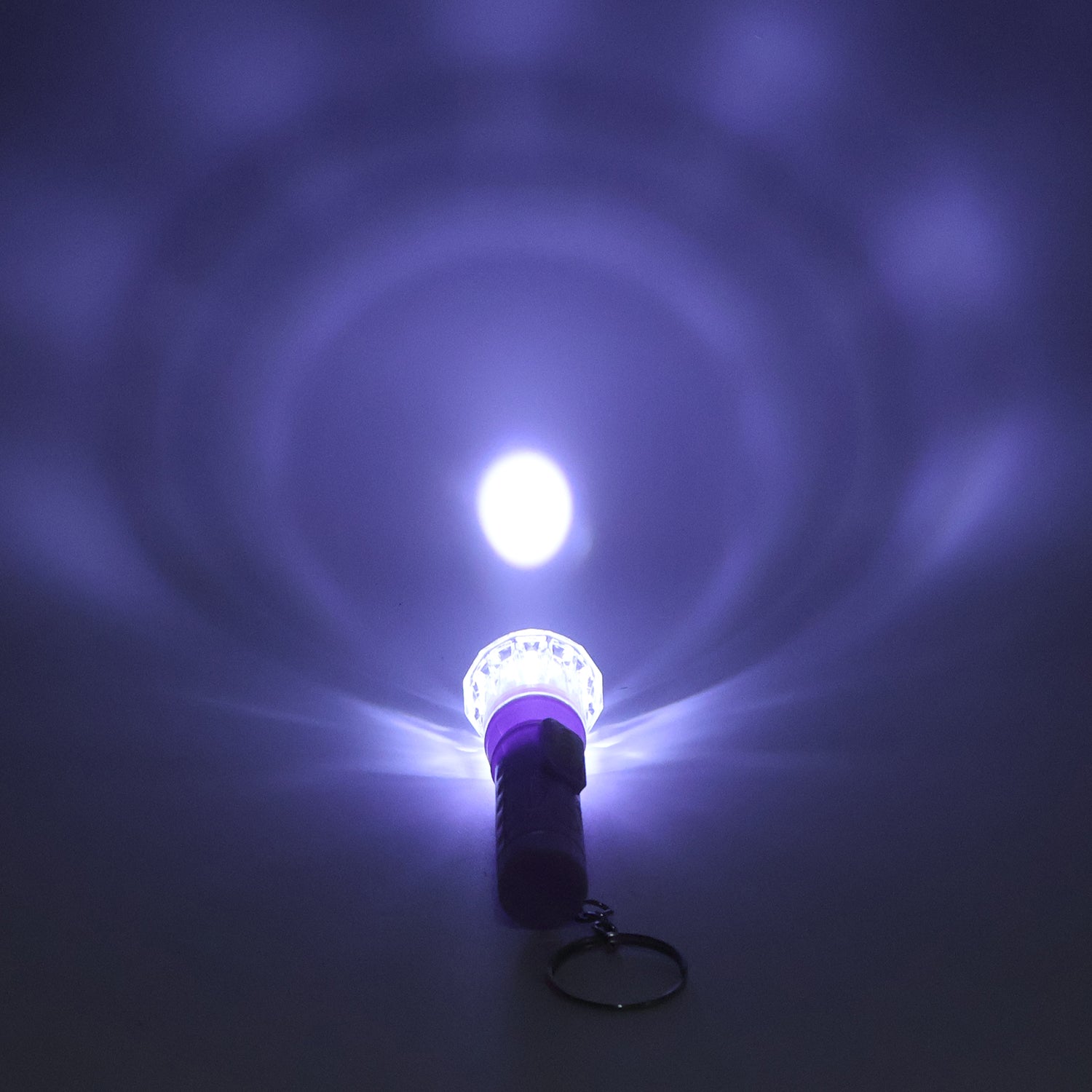 Wukusy Mini LED flashlight keychain torch in mixed colors, compact toy with bright LED light and colorful design.