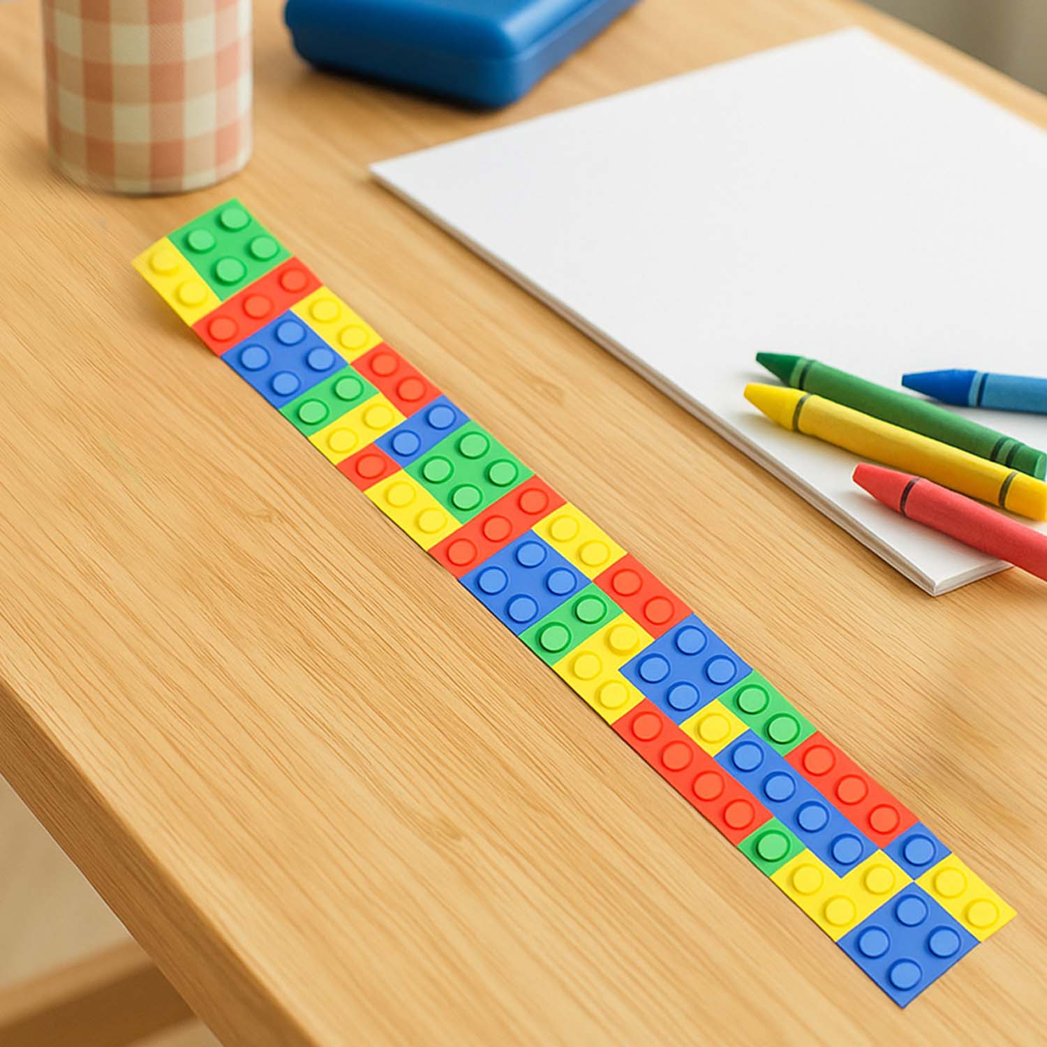 Set of 12 colorful Snap Slap Bracelets by Wukusy, flexible plastic toy bracelets with vibrant patterns and easy snap closure.