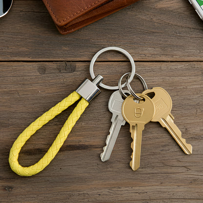 Set of four Wukusy braided loop keychains in various colors on a neutral background.