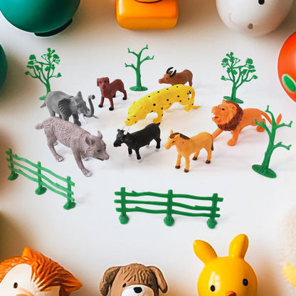 Colorful 14-piece Animal Kingdom plastic toy set for kids by Wukusy featuring various animal figures.