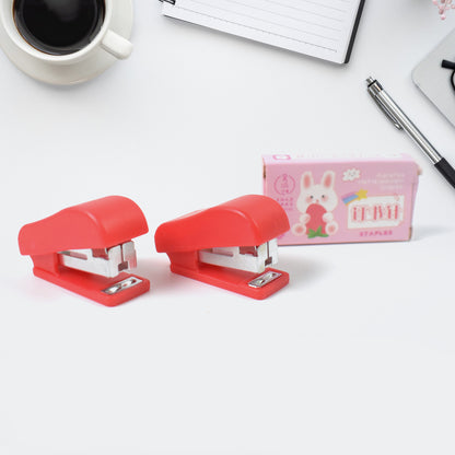 Wukusy mini office stapler with staples and pin set, compact and portable for everyday paper fastening tasks.