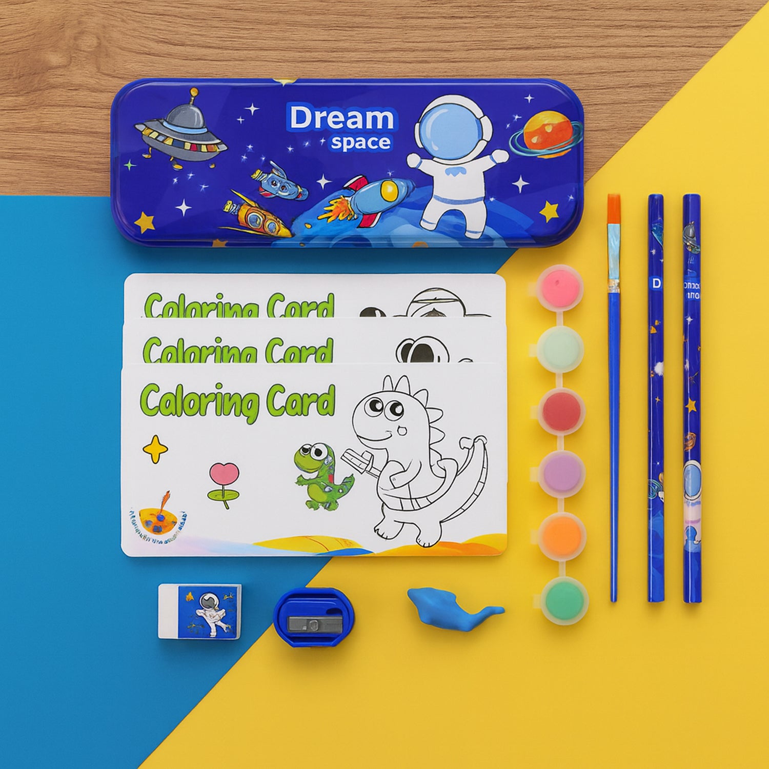 Colorful space-themed kids stationery set by Wukusy featuring planets, stars, and rockets on assorted paper and writing supplies.