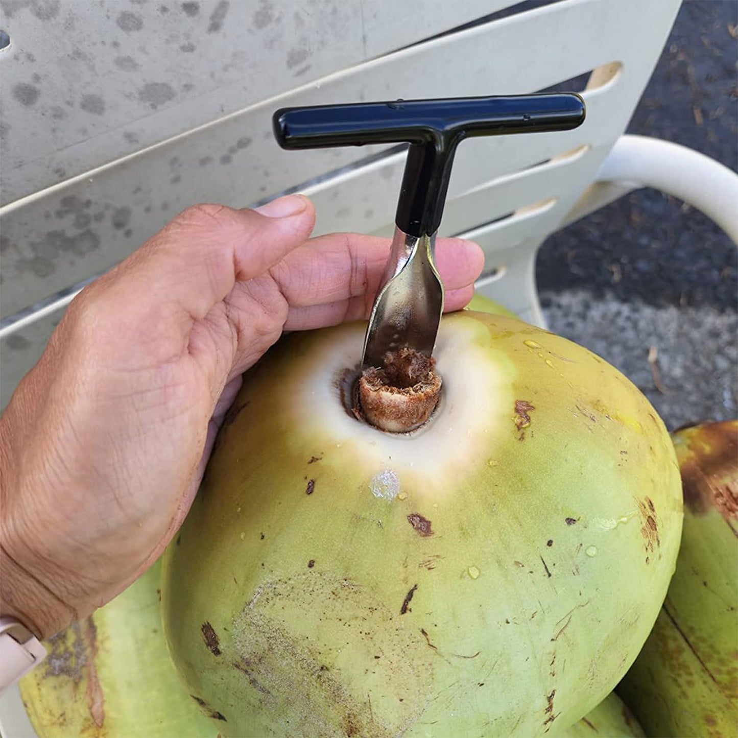 Wukusy stainless steel coconut breaker tool with T-handle, designed for opening coconuts easily in home and kitchen use.