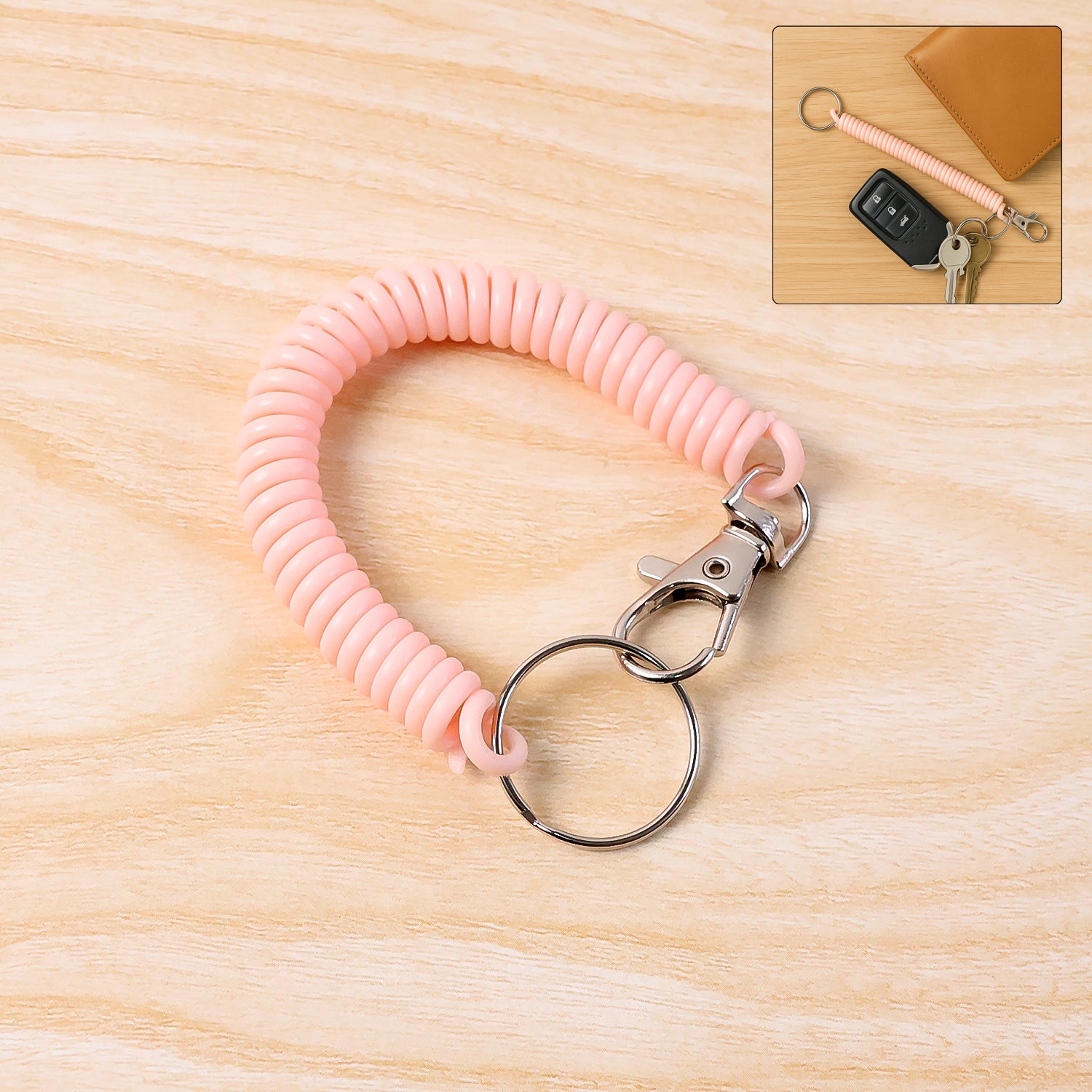 Elastic spiral coil keychain bracelet with metal key ring and clip hook, by Wukusy, shown in close-up with a coiled design.