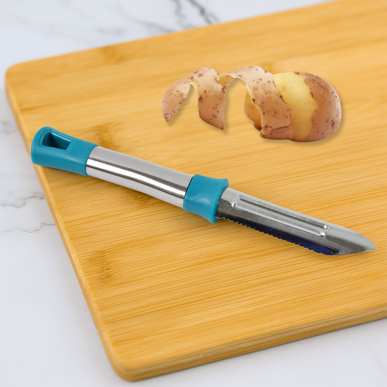 Wukusy Apex Premium stainless steel vegetable and fruit peeler with ergonomic handle on a kitchen countertop.