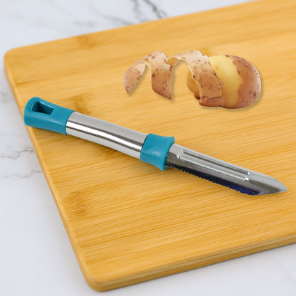 Wukusy Apex Premium stainless steel vegetable and fruit peeler with ergonomic handle on a kitchen countertop.