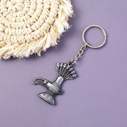 Premium metal Shiva Lingam with Naag keychain by Wukusy, featuring detailed Shiva Lingam and Naag design on a keychain.