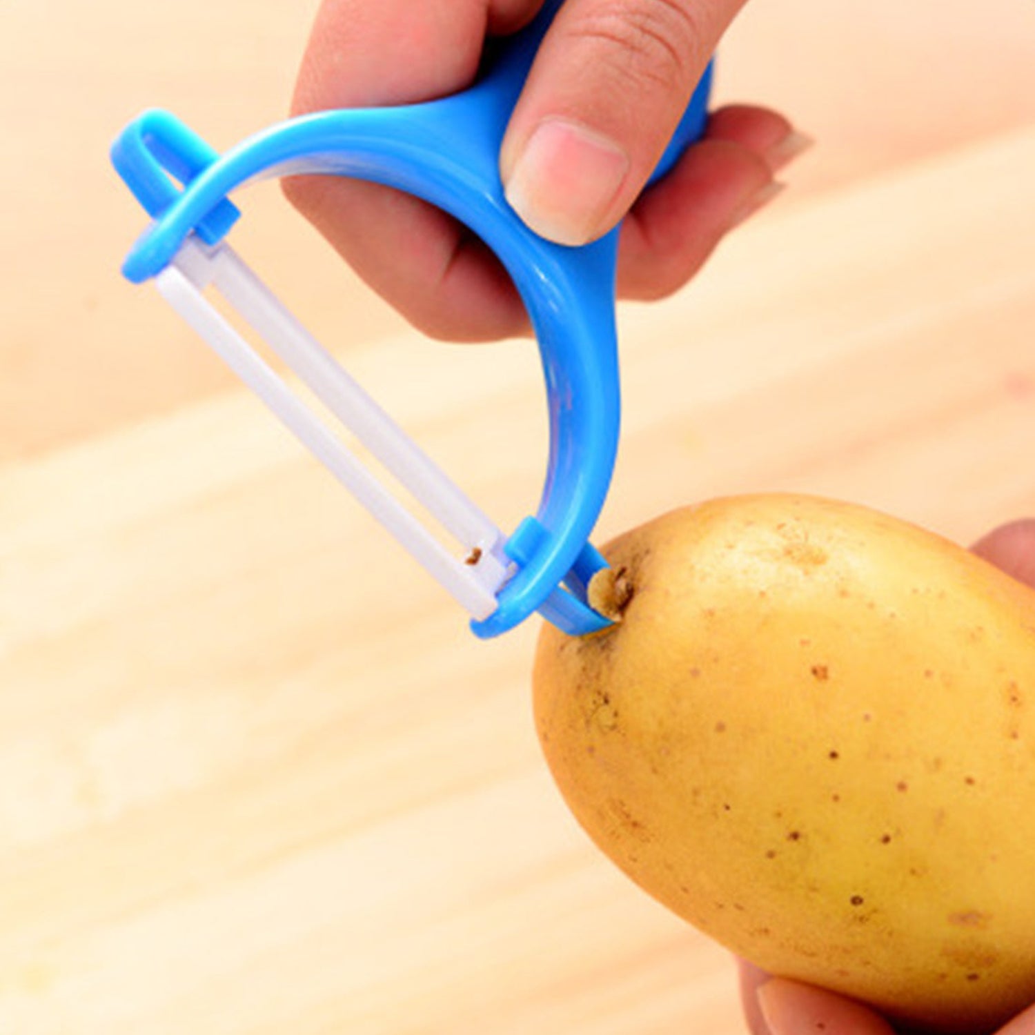 Wukusy vegetable and fruit peeler for kitchen use, with ergonomic handle and sharp blade for peeling vegetables and fruits efficiently.