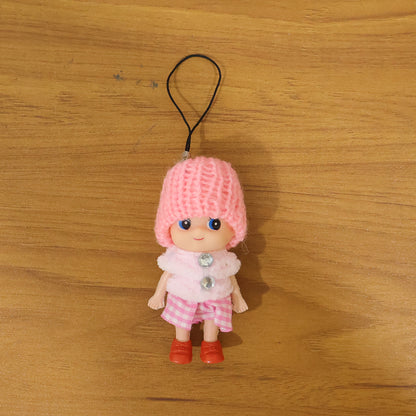 Cute mini doll keychain by Wukusy featuring a soft knitted cap girl charm on a colorful keyring.
