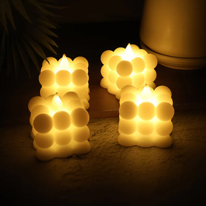 Set of four Wukusy decorative LED bubble candles for home decor, featuring glowing, bubble-like designs.