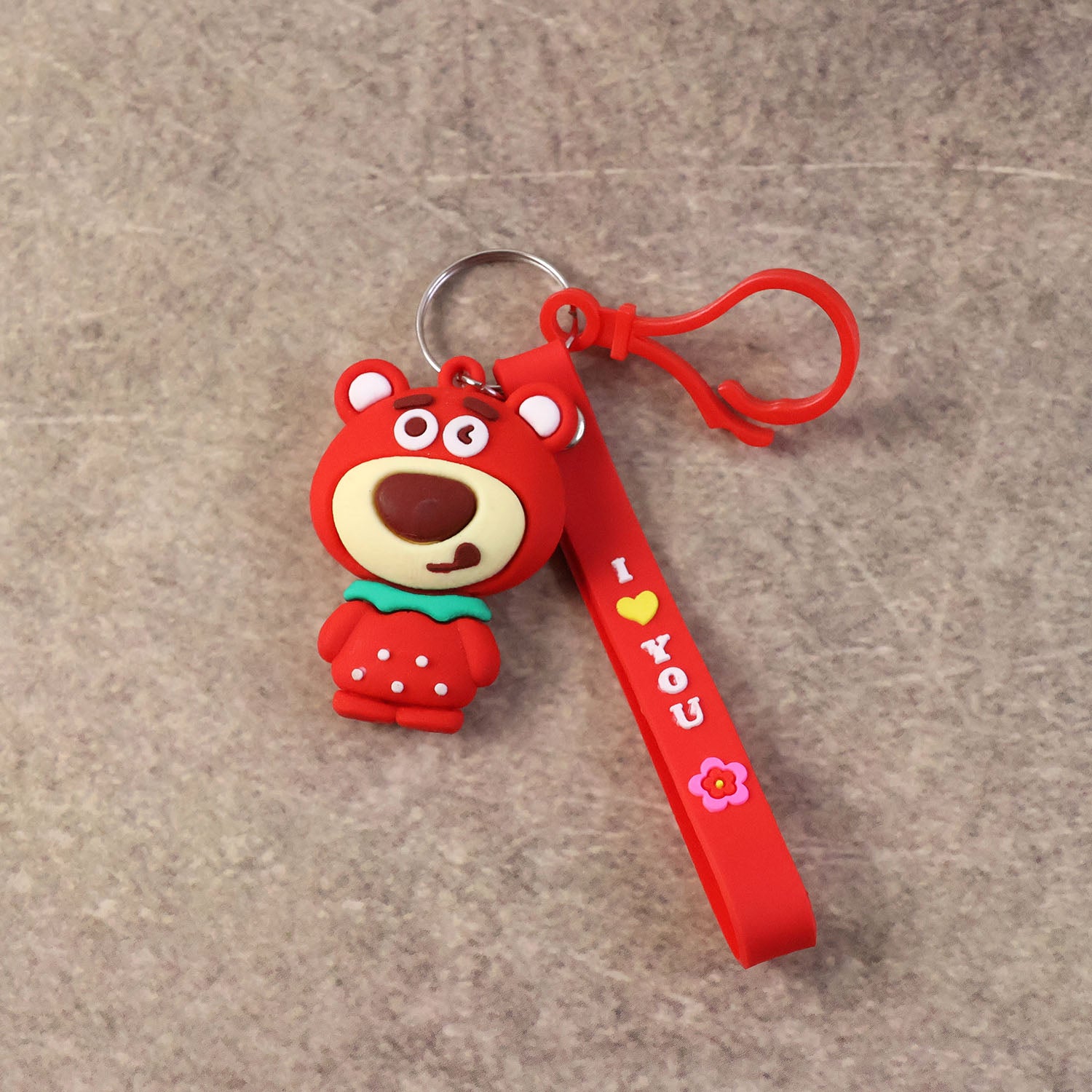 Cute cartoon bear figure keychain by Wukusy, featuring a small plush bear design with detailed facial features and colorful accents.