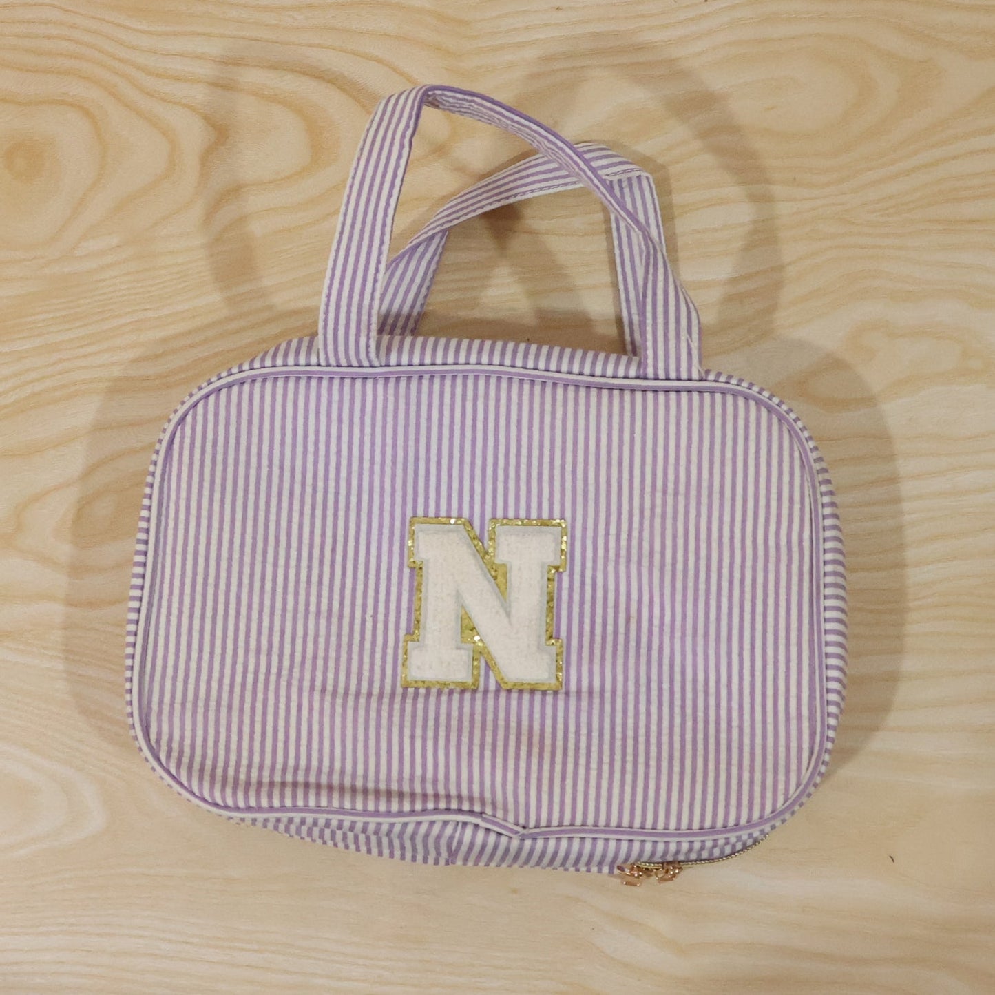 Wukusy travel multi-pocket toiletry bag hanging cosmetic organizer with multiple compartments for toiletries and makeup.