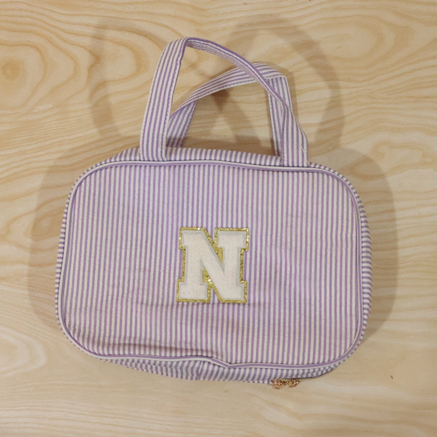Wukusy travel multi-pocket toiletry bag hanging cosmetic organizer with multiple compartments for toiletries and makeup.