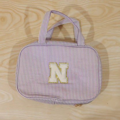 Wukusy travel multi-pocket toiletry bag hanging cosmetic organizer with multiple compartments for toiletries and makeup.